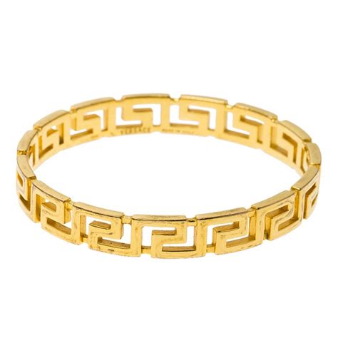 versace gold bangle|versace g string.